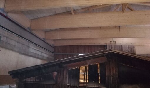 Construction of new roofing above old saw mill during ongoing operations