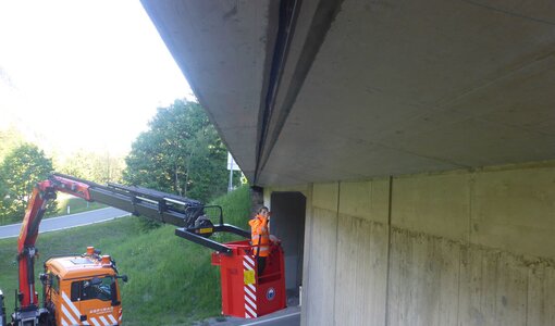 Inspection of condition bridge on the S16 with basket crane of Asfinag